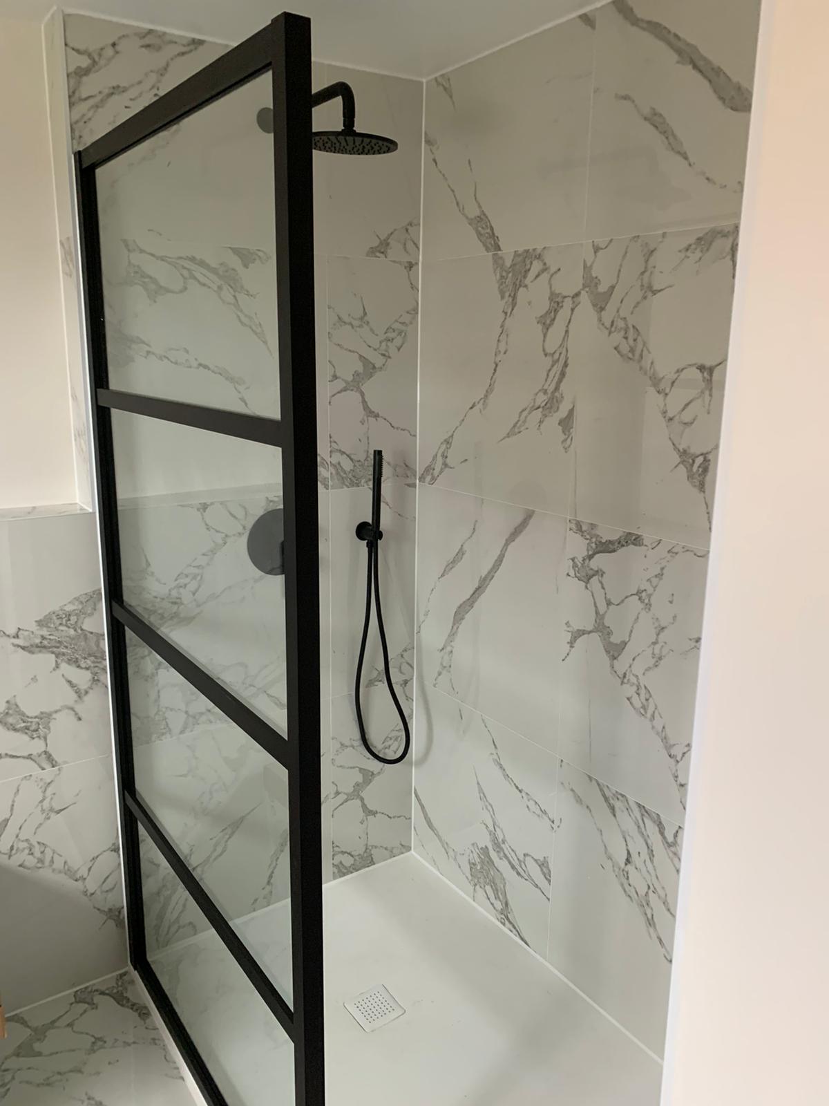 Marble shower renovation, black frame walk-in shower