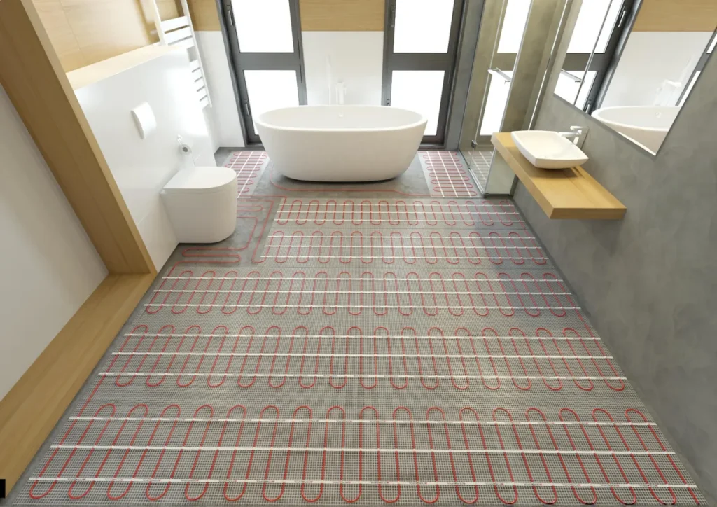 Electric underfloor heating installed beneath floor tiles during a modern bathroom renovation.